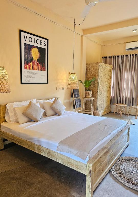 The deluxe family suite at Mellow Bay, with a large bed and wooden furniture
